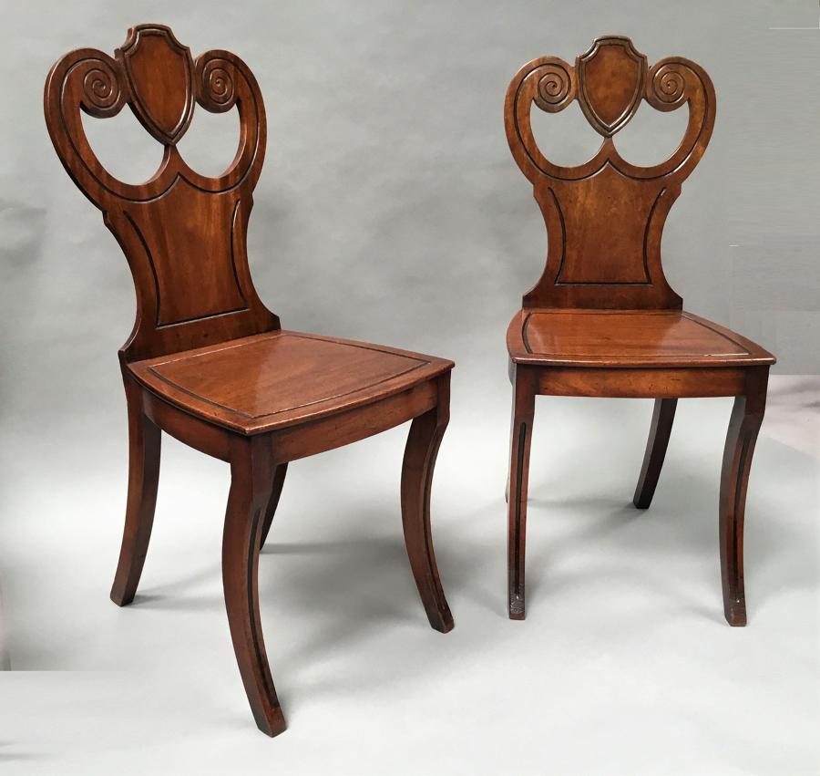Regency pair of mahogany hall chairs