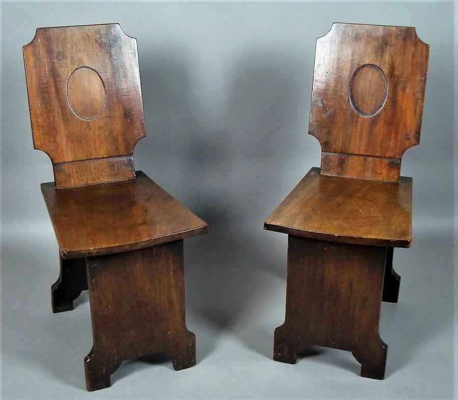 Regency pair of mahogany hall chairs
