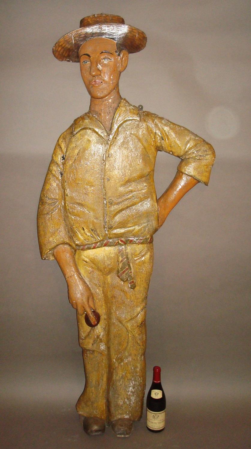 C20th carved wood and painted colonial cricketer