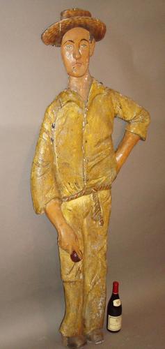 C20th carved wood and painted colonial cricketer