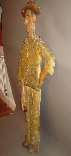 C20th carved wood and painted colonial cricketer
