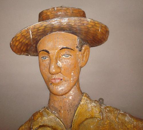 C20th carved wood and painted colonial cricketer