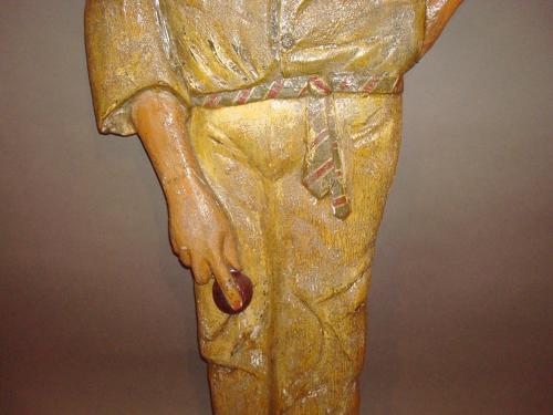 C20th carved wood and painted colonial cricketer