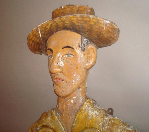 C20th carved wood and painted colonial cricketer