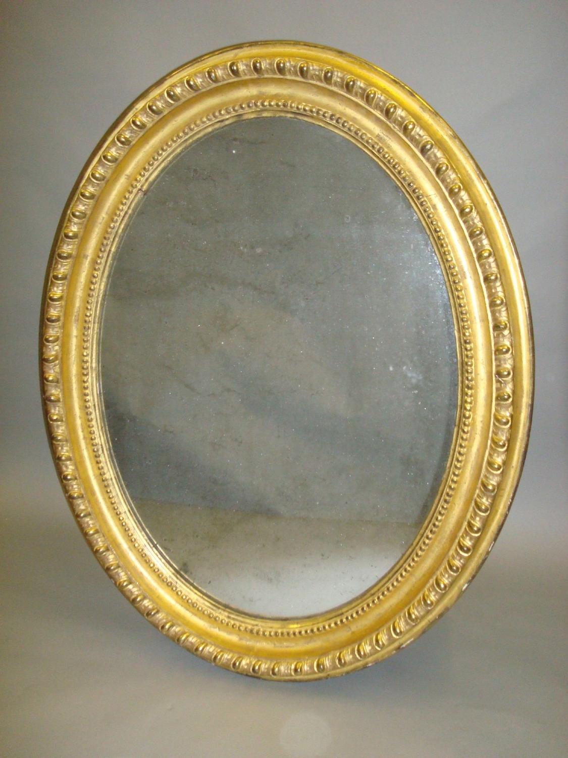 C19th giltwood oval wall mirror