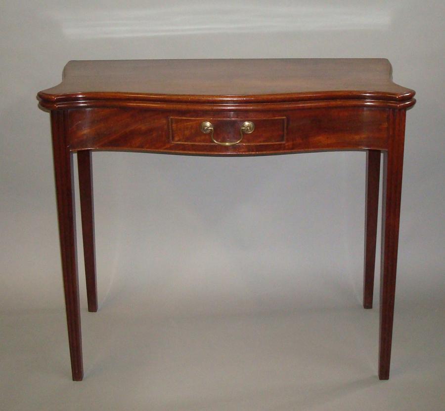 George III serpentine mahogany tea table