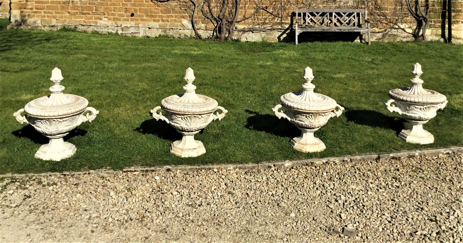 Late C19th rare set of four cast iron terrace / garden urns