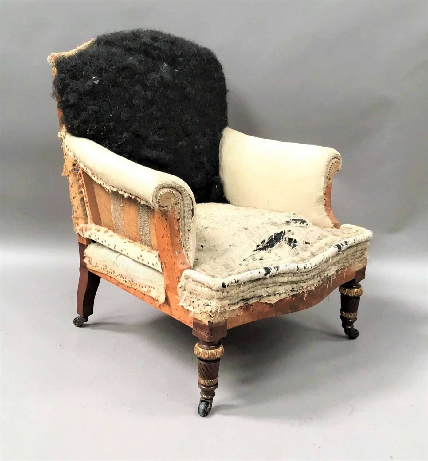 C19th mahogany upholstered library armchair