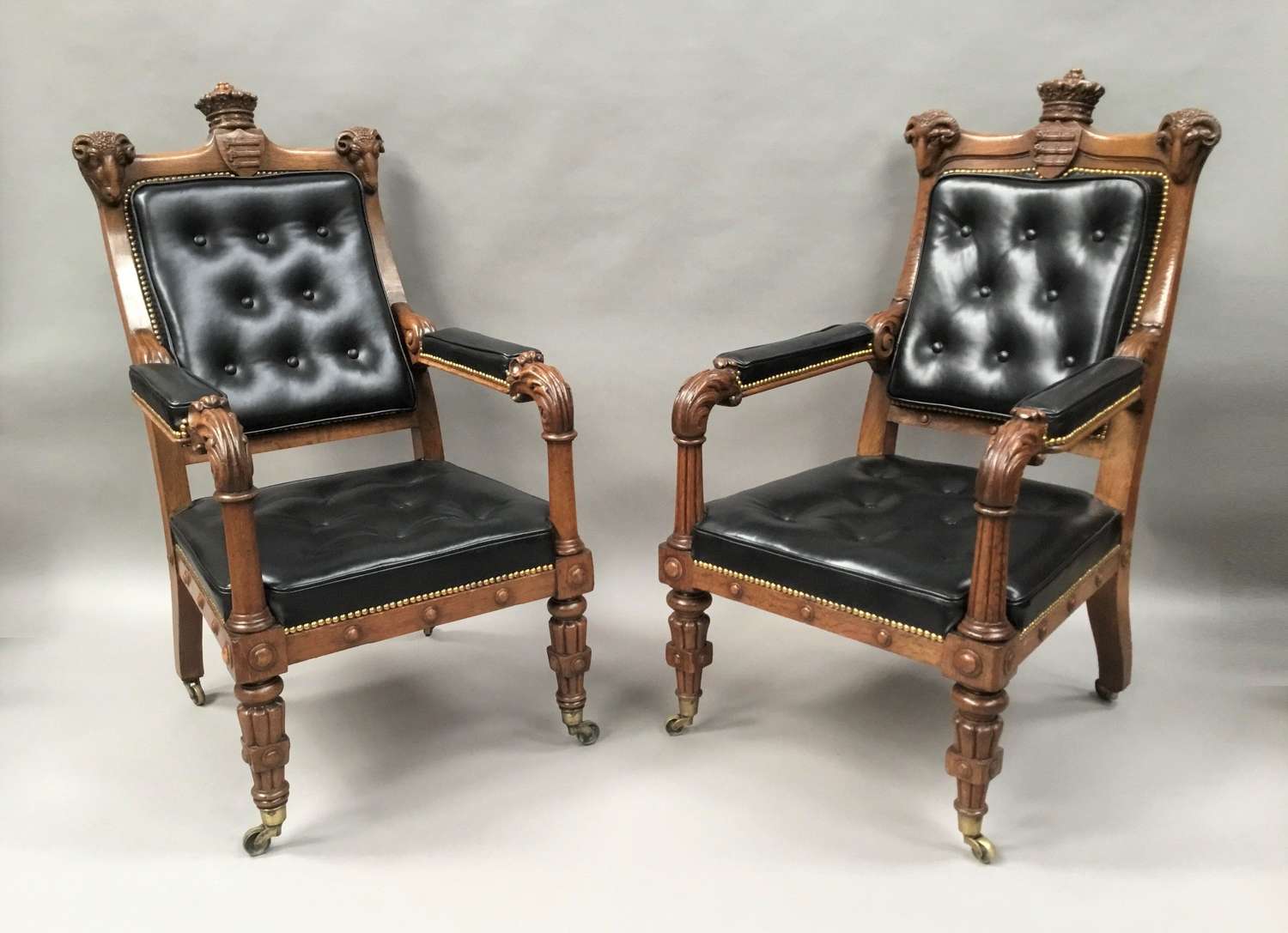 C19th pair oak and leather library chairs