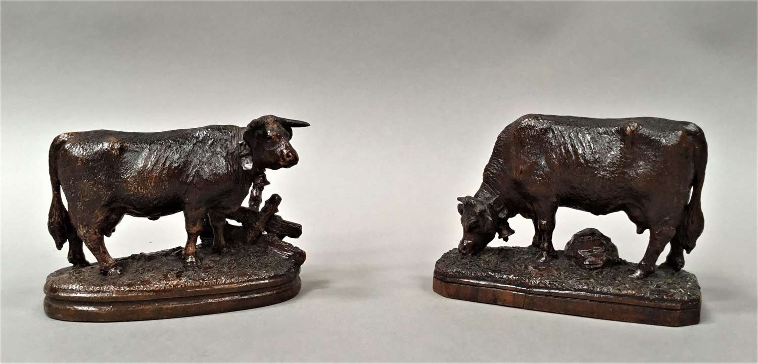 Late C19th pair of carved Black Forest cows