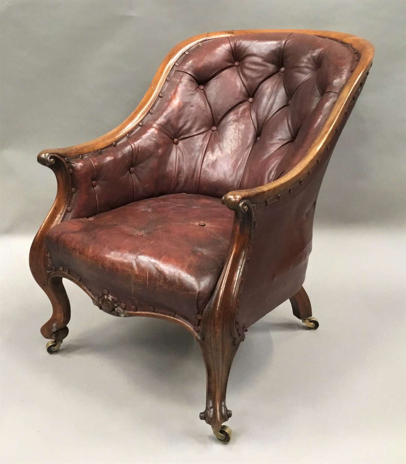 C19th walnut and leather library armchair