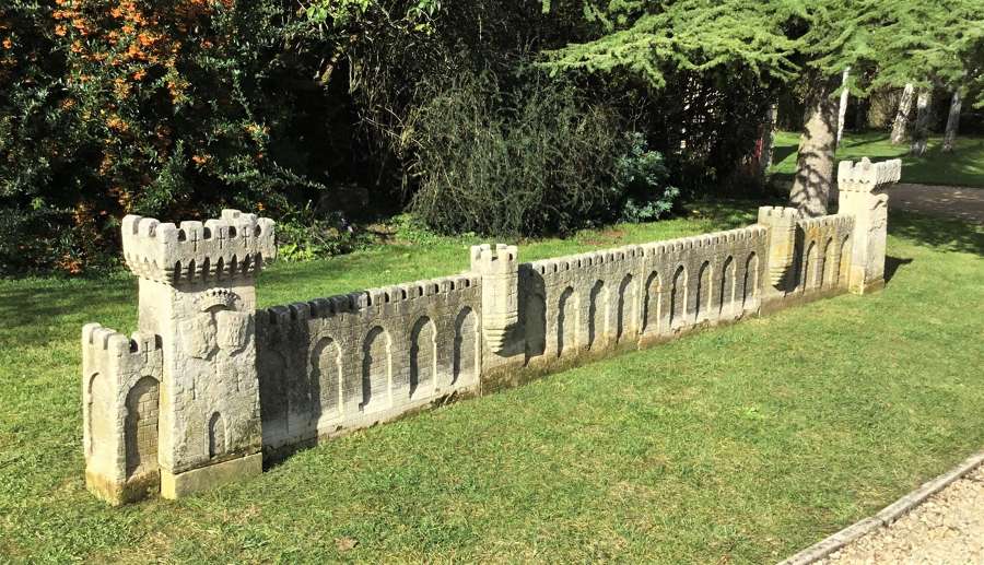 C18th carved stone 19ft scale replica of a castle / chateau wall