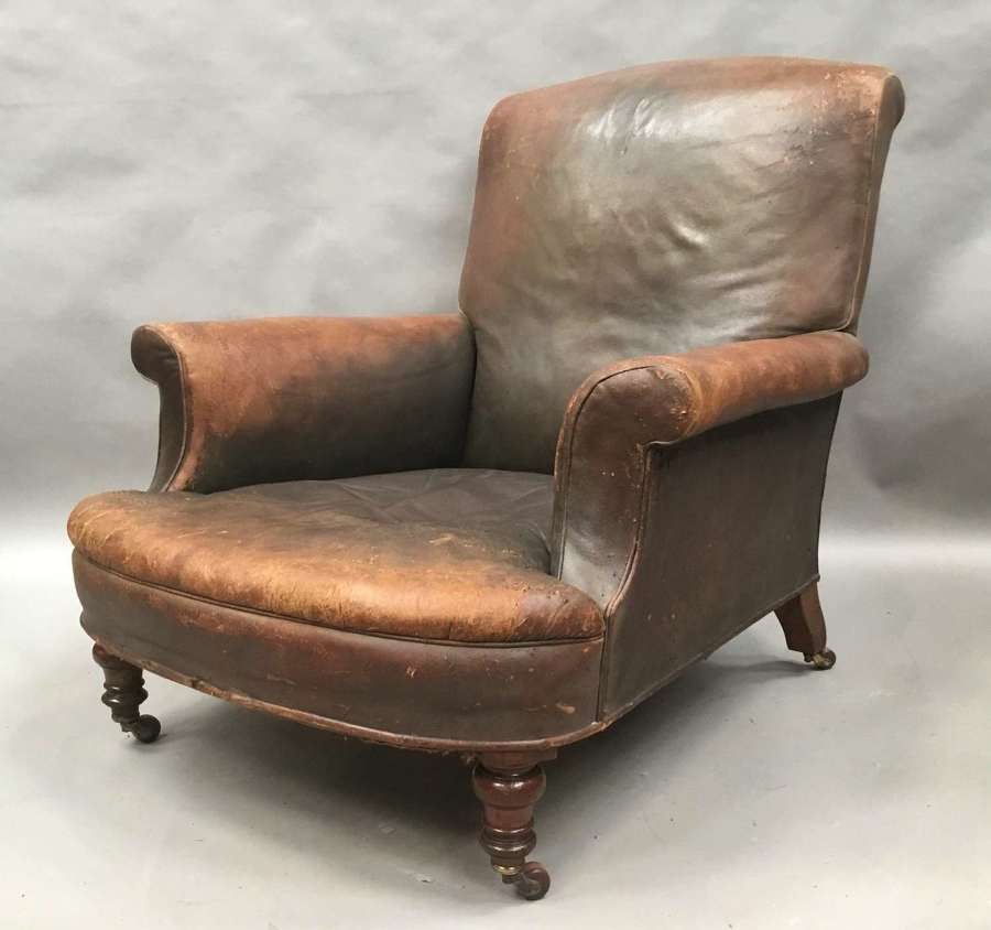 C19th large upholstered armchair in original leather
