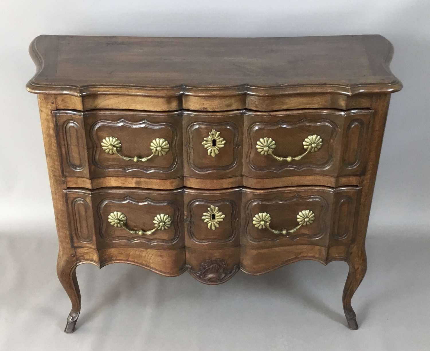 C18th French provincial walnut serpentine commode