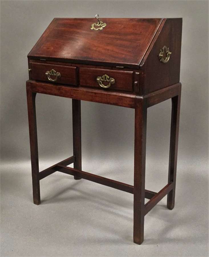 George II mahogany bureau on stand in the manner of Thomas Chippendale