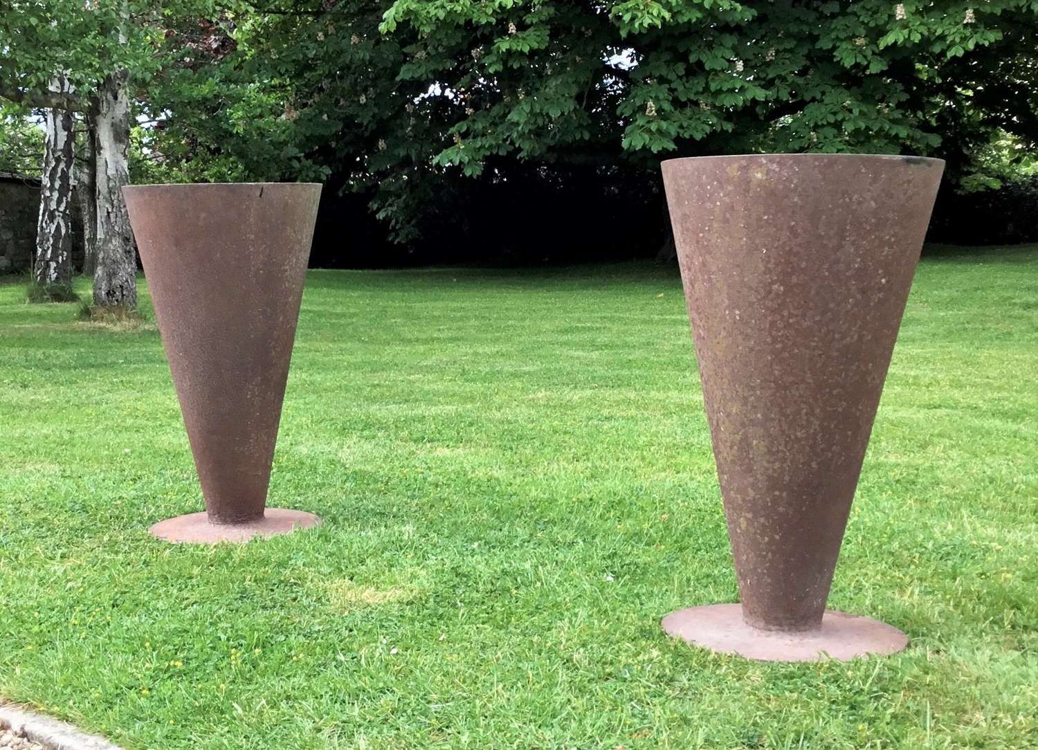 C20th pair of cast iron conical shaped garden urns / planters
