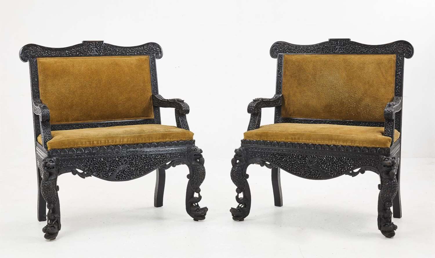 Extraordinary C19th pair of Indian carved hardwood chairs / hall seats