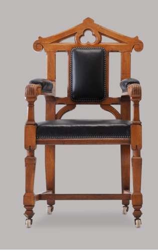 An unusual C19th pair of golden oak and leather open armchairs