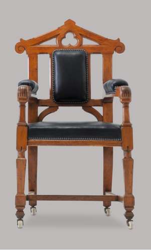An unusual C19th pair of golden oak and leather open armchairs