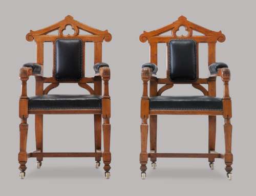 An unusual C19th pair of golden oak and leather open armchairs