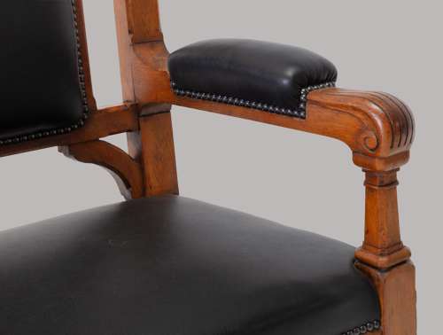 An unusual C19th pair of golden oak and leather open armchairs