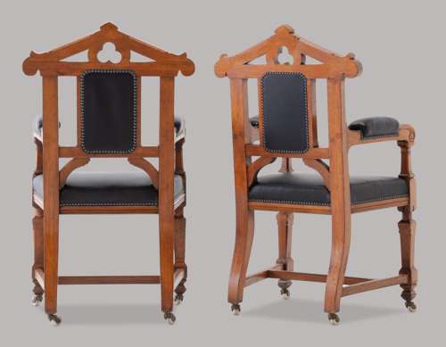 An unusual C19th pair of golden oak and leather open armchairs