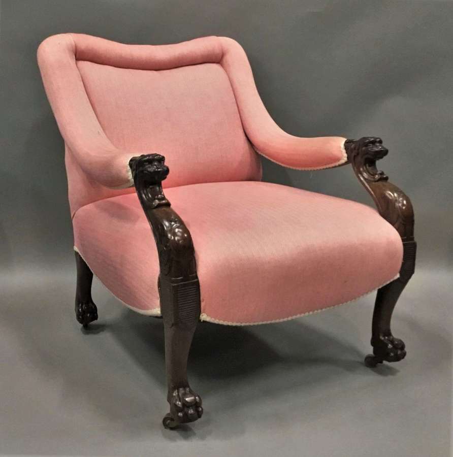 An impressive Regency mahogany open arm library chair