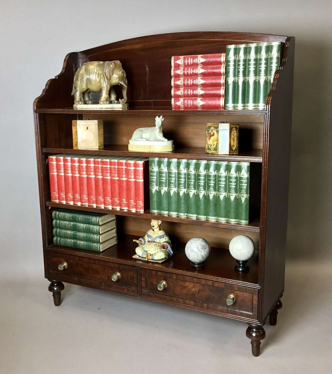 Handsome Regency figured mahogany open bookcase