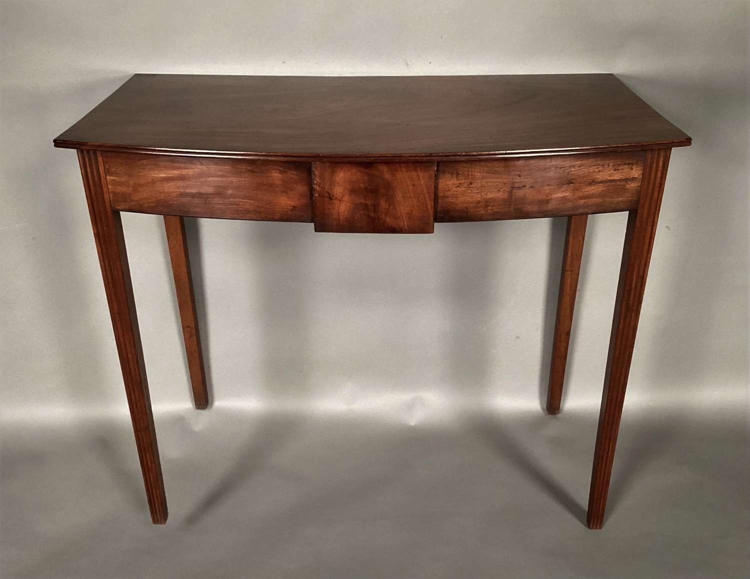 George III mahogany Hepplewhite bow fronted side table