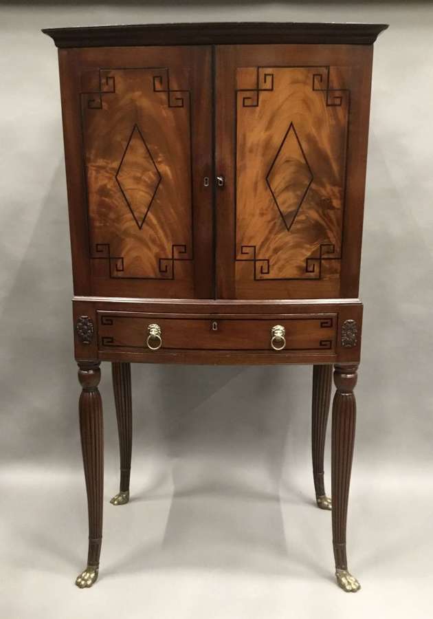 Good Regency mahogany bow fronted cabinet on stand