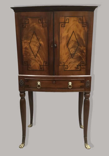 Good Regency mahogany bow fronted cabinet on stand