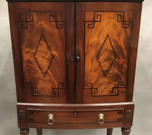 Good Regency mahogany bow fronted cabinet on stand