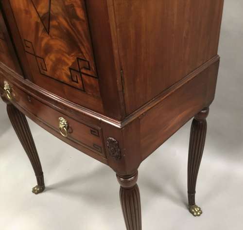 Good Regency mahogany bow fronted cabinet on stand