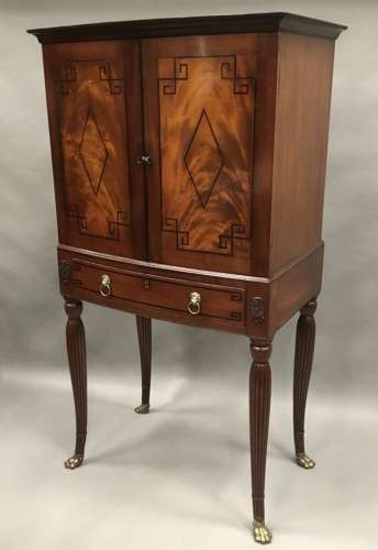 Good Regency mahogany bow fronted cabinet on stand