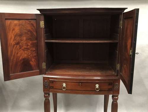 Good Regency mahogany bow fronted cabinet on stand