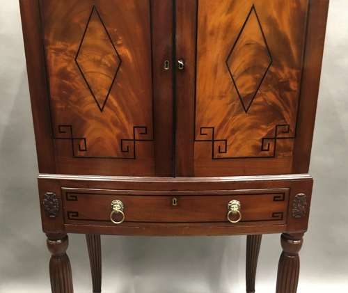 Good Regency mahogany bow fronted cabinet on stand