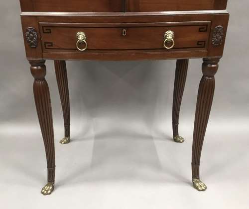 Good Regency mahogany bow fronted cabinet on stand