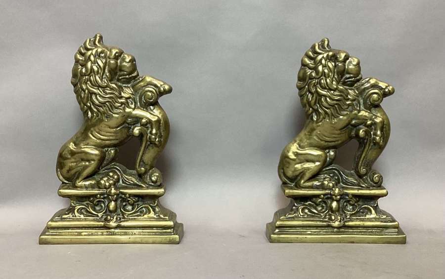 Rare C19th pair of brass lion doorstops / door porters