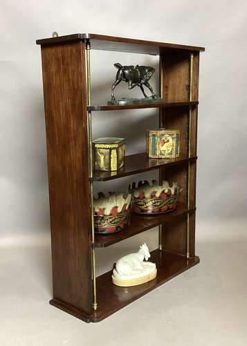 Good Regency mahogany and brass hanging wall shelves