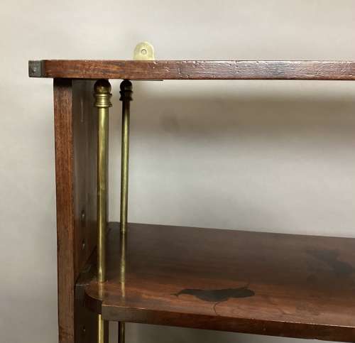 Good Regency mahogany and brass hanging wall shelves