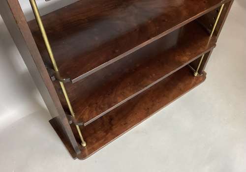 Good Regency mahogany and brass hanging wall shelves