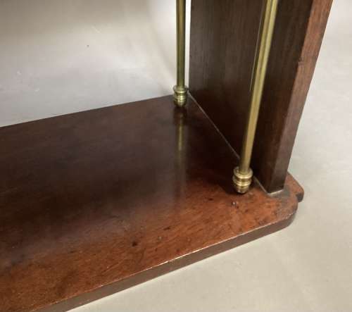 Good Regency mahogany and brass hanging wall shelves