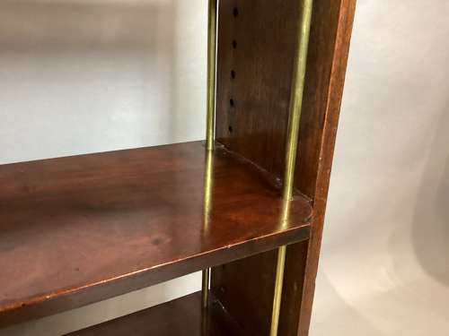 Good Regency mahogany and brass hanging wall shelves
