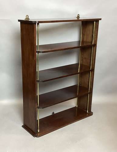 Good Regency mahogany and brass hanging wall shelves