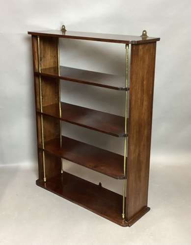 Good Regency mahogany and brass hanging wall shelves