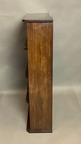 Good Regency mahogany and brass hanging wall shelves
