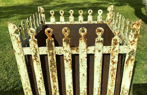 Rare C19th pair of wrought iron strapwork planters