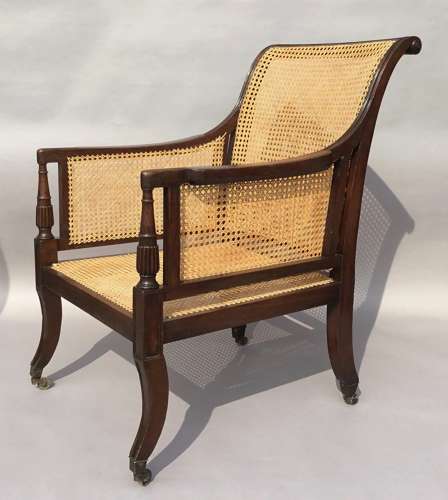 A splendid Regency mahogany bergere library chair