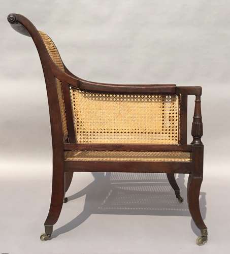 A splendid Regency mahogany bergere library chair