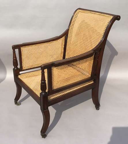 A splendid Regency mahogany bergere library chair